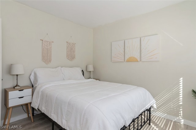 bedroom featuring hardwood / wood-style floors