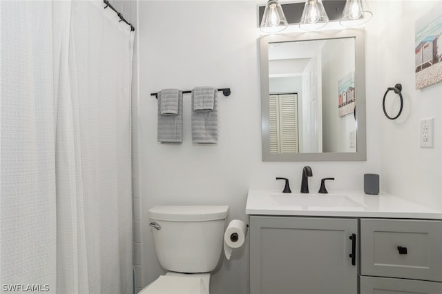 bathroom with toilet and vanity