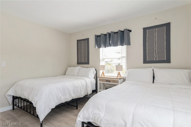 bedroom featuring hardwood / wood-style flooring