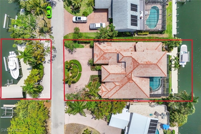 birds eye view of property featuring a water view