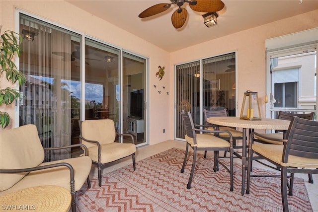 exterior space featuring ceiling fan