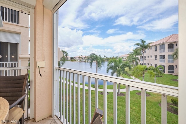 balcony featuring a water view