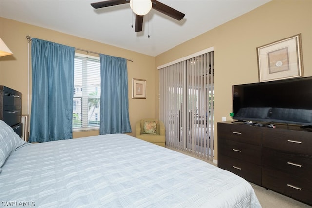 bedroom featuring light colored carpet and ceiling fan