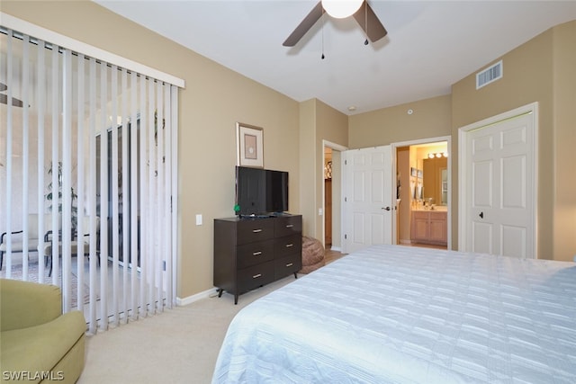 carpeted bedroom featuring connected bathroom and ceiling fan