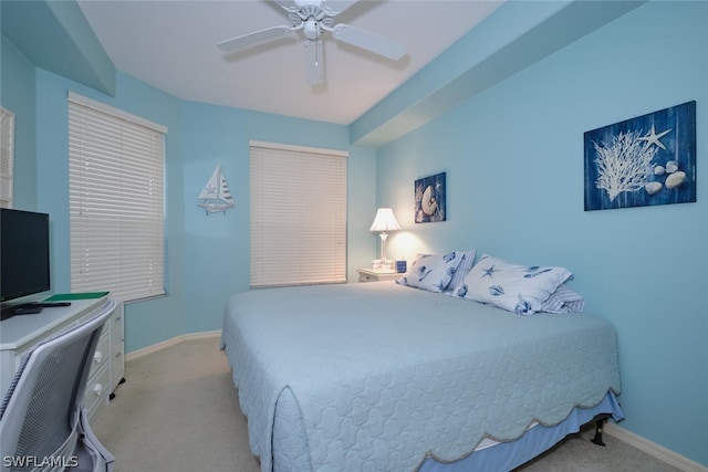 bedroom with ceiling fan and carpet