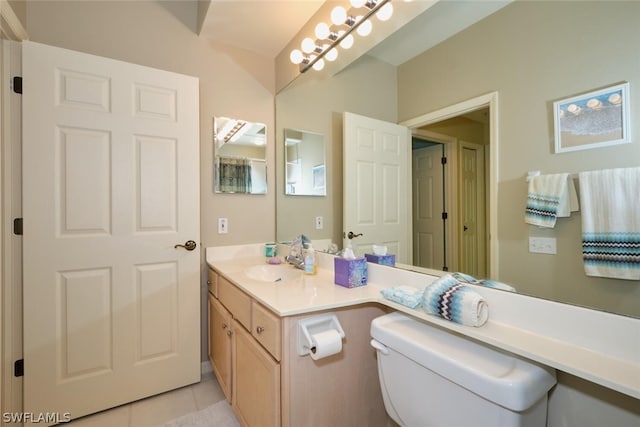 bathroom featuring tile floors, oversized vanity, and toilet