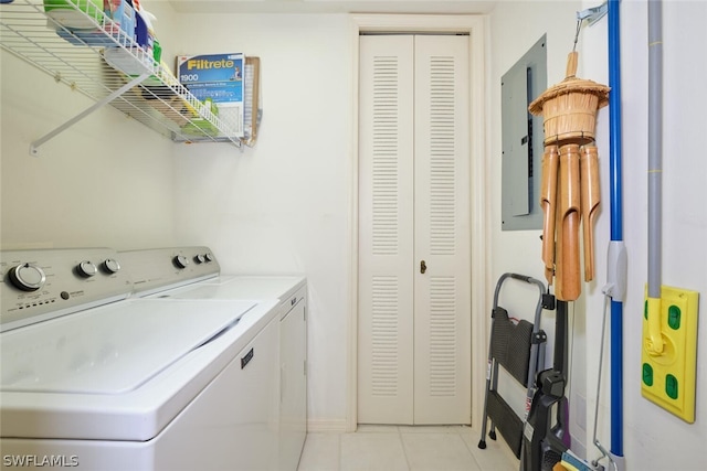 laundry room with light tile floors and washing machine and clothes dryer