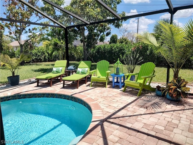 view of pool featuring a lanai and a patio