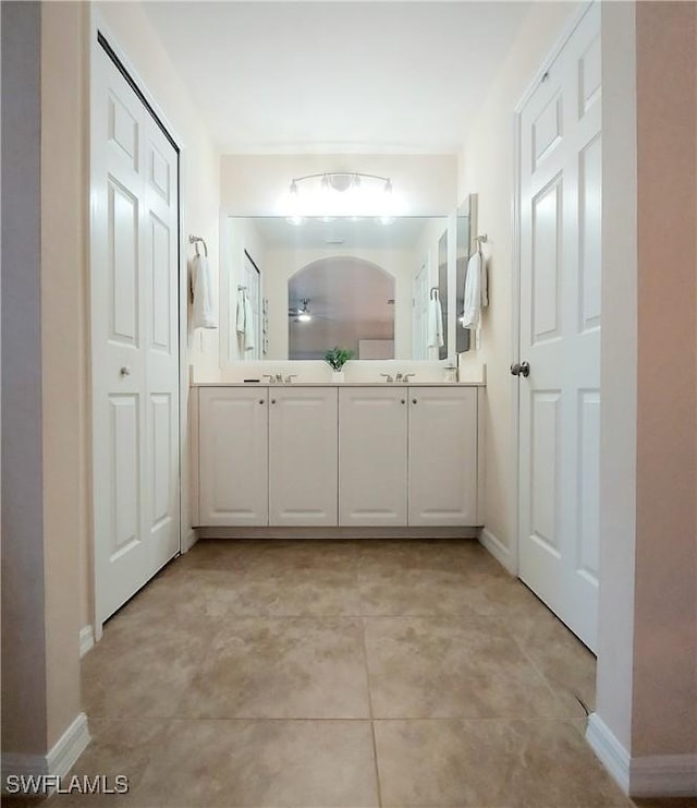 bathroom with vanity and tile patterned floors