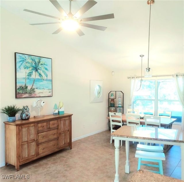 dining space featuring lofted ceiling and ceiling fan