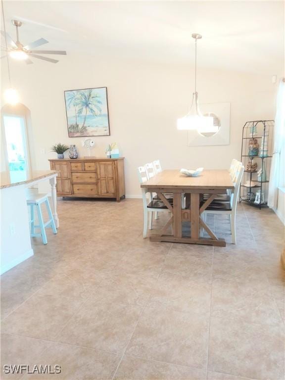 dining area featuring ceiling fan and light tile patterned floors