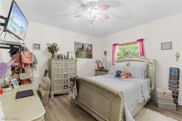 bedroom featuring wood-type flooring and ceiling fan