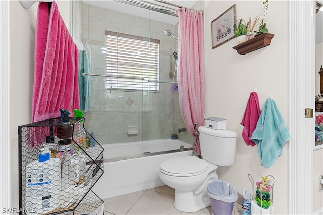 bathroom featuring toilet, tile floors, and shower / tub combo with curtain