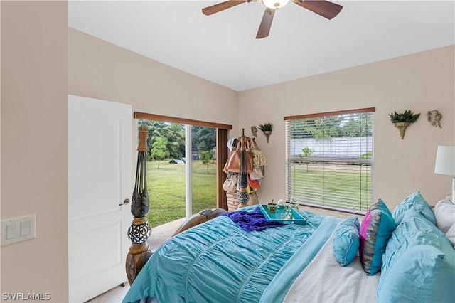 bedroom featuring multiple windows and ceiling fan