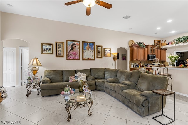 living room with ceiling fan and light tile floors