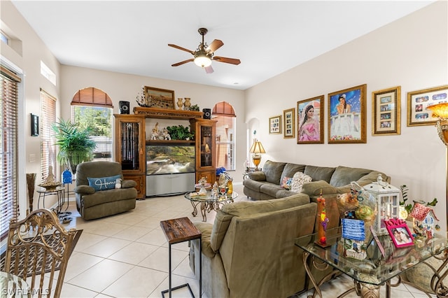 tiled living room featuring ceiling fan