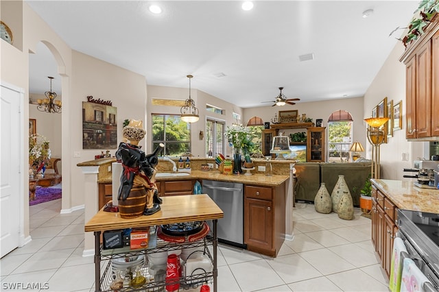 kitchen featuring dishwasher, ceiling fan, pendant lighting, and light tile floors