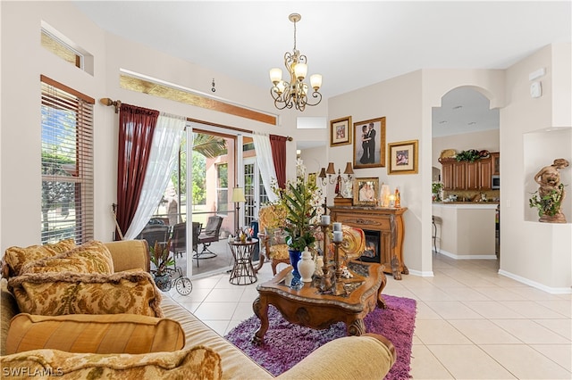 living room featuring a chandelier and light tile flooring