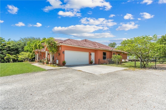 mediterranean / spanish-style home featuring a garage