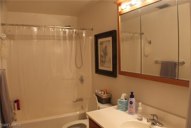 full bathroom featuring shower / tub combo, toilet, and vanity