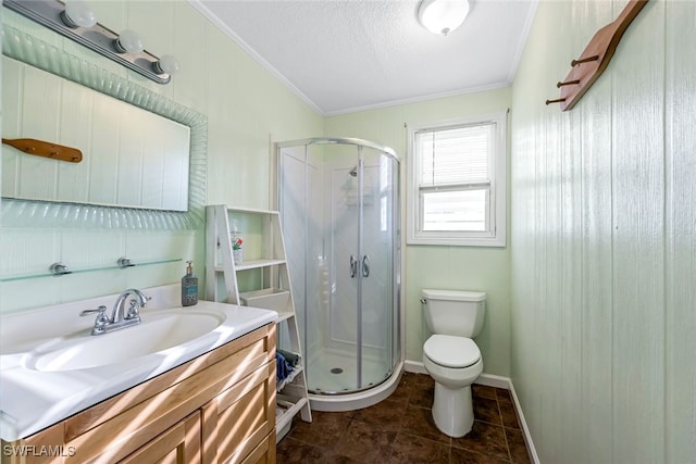 bathroom featuring ornamental molding, vanity, and a shower with shower door