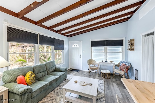 living room with hardwood / wood-style flooring and lofted ceiling with beams