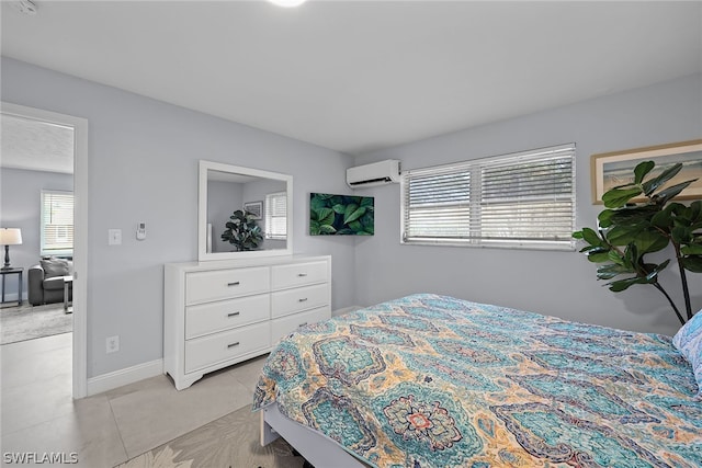 tiled bedroom with a wall unit AC