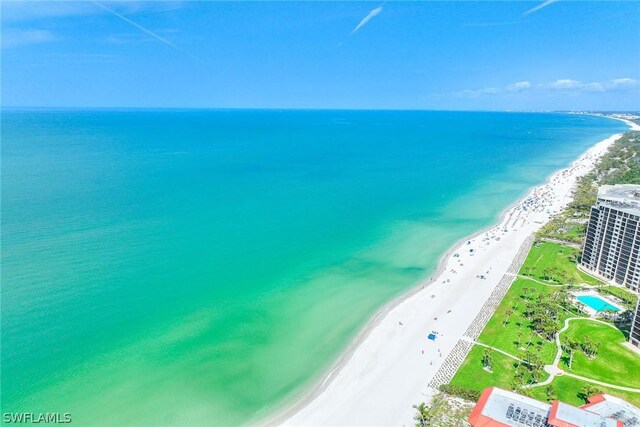 birds eye view of property with a view of the beach and a water view