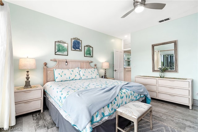 bedroom featuring ceiling fan and hardwood / wood-style floors