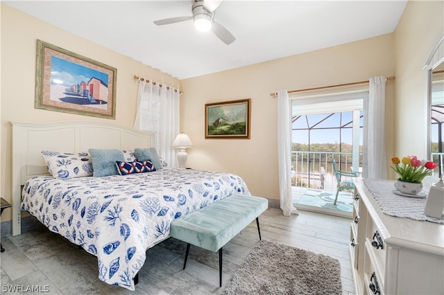 bedroom with access to outside, hardwood / wood-style flooring, and ceiling fan