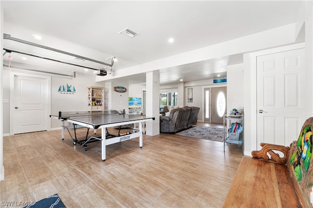 playroom with light hardwood / wood-style flooring