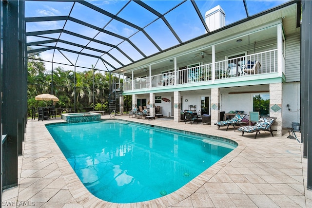 view of swimming pool featuring an in ground hot tub and a patio area