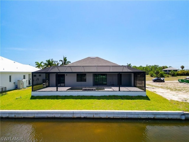 rear view of property with a patio, a water view, and glass enclosure