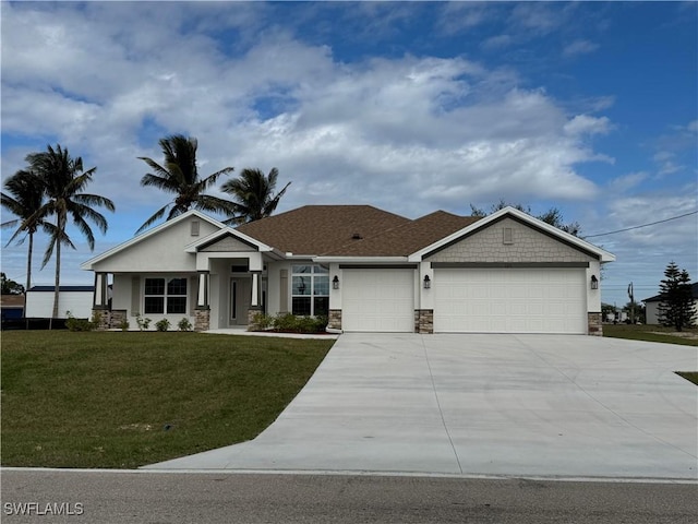 view of front of home featuring a front lawn and a garage