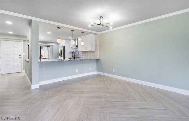 interior space with light parquet floors, an inviting chandelier, crown molding, and sink