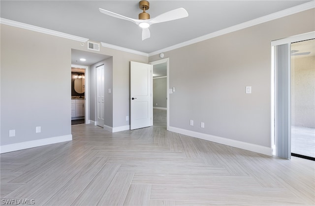 empty room featuring ornamental molding, ceiling fan, and light parquet flooring