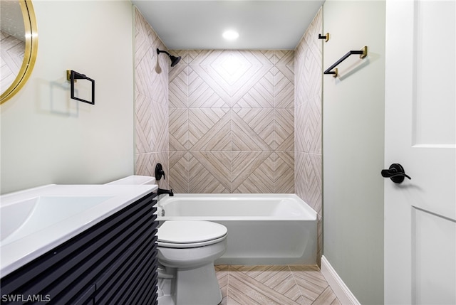 full bathroom featuring vanity, toilet, and tiled shower / bath