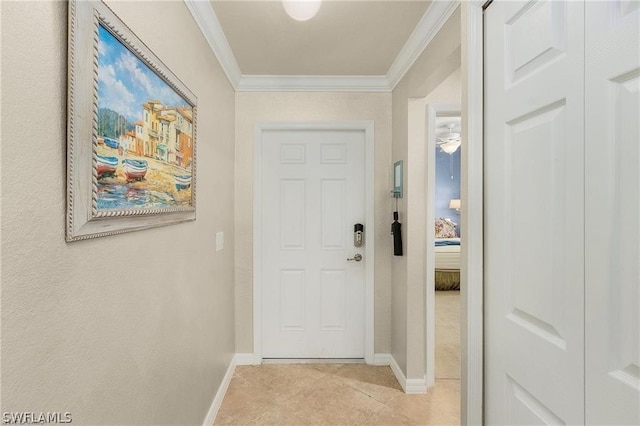 doorway featuring ornamental molding and light tile floors