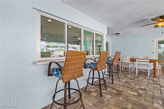 view of patio / terrace featuring ceiling fan