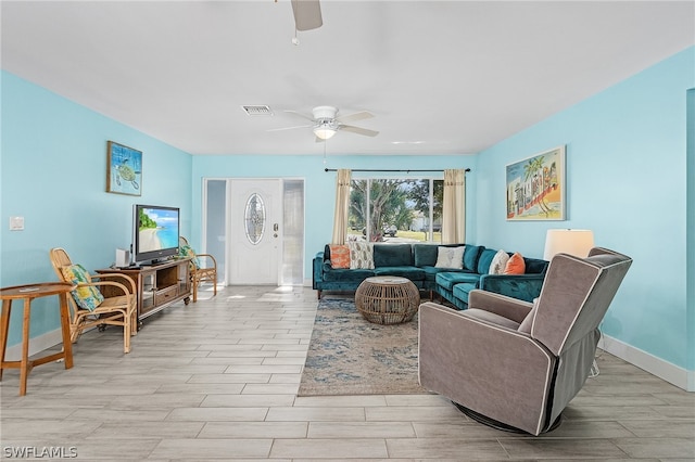 living room featuring ceiling fan