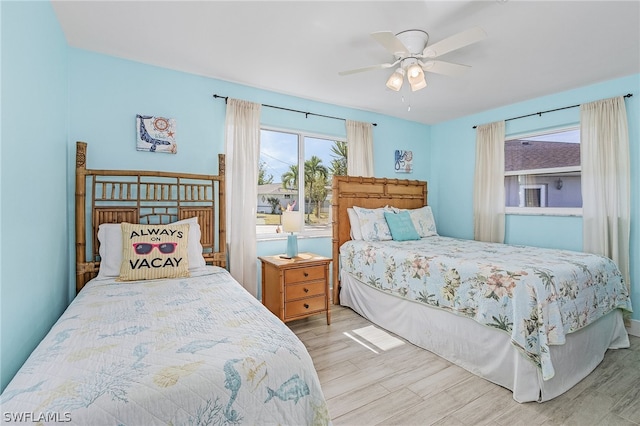 bedroom featuring ceiling fan and light wood-type flooring