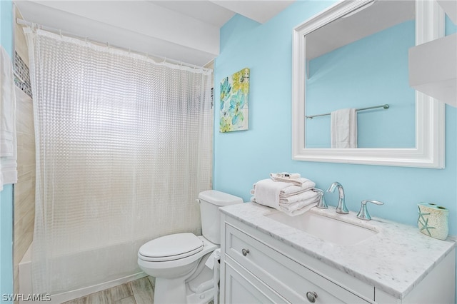 bathroom featuring oversized vanity and toilet