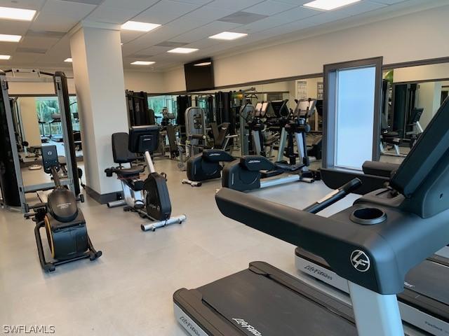 exercise room with a paneled ceiling