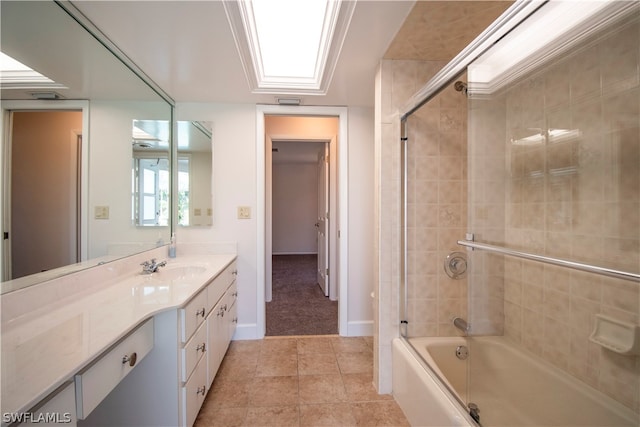 bathroom featuring tile floors, vanity, and shower / bath combination with glass door