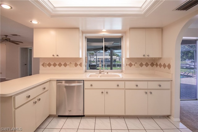 kitchen featuring light tile flooring, dishwasher, backsplash, and ceiling fan