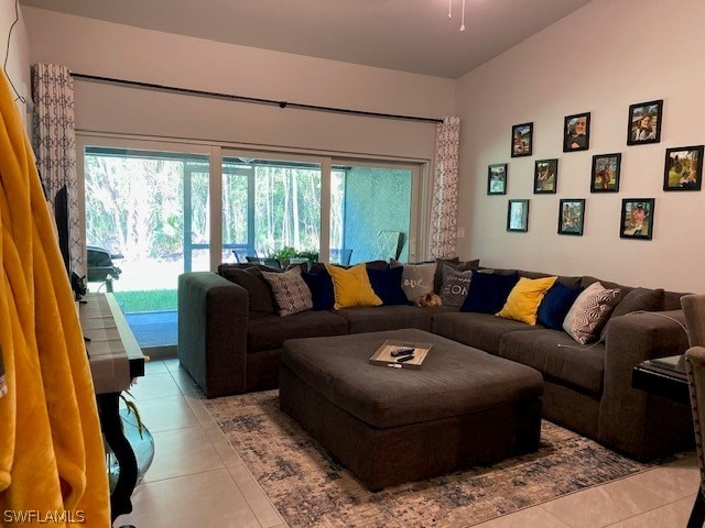 living room featuring a healthy amount of sunlight and tile flooring