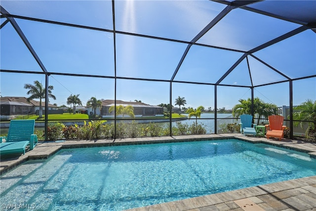 view of swimming pool featuring a lanai