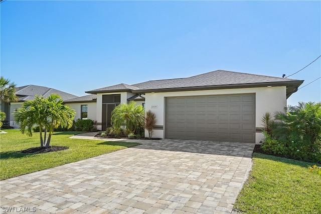 view of front of property with a garage and a front yard