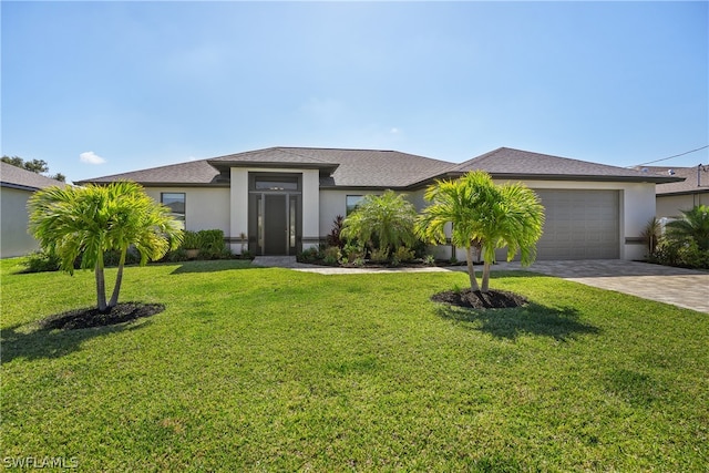 view of front facade with a front lawn and a garage