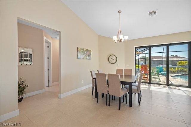 tiled dining space featuring an inviting chandelier